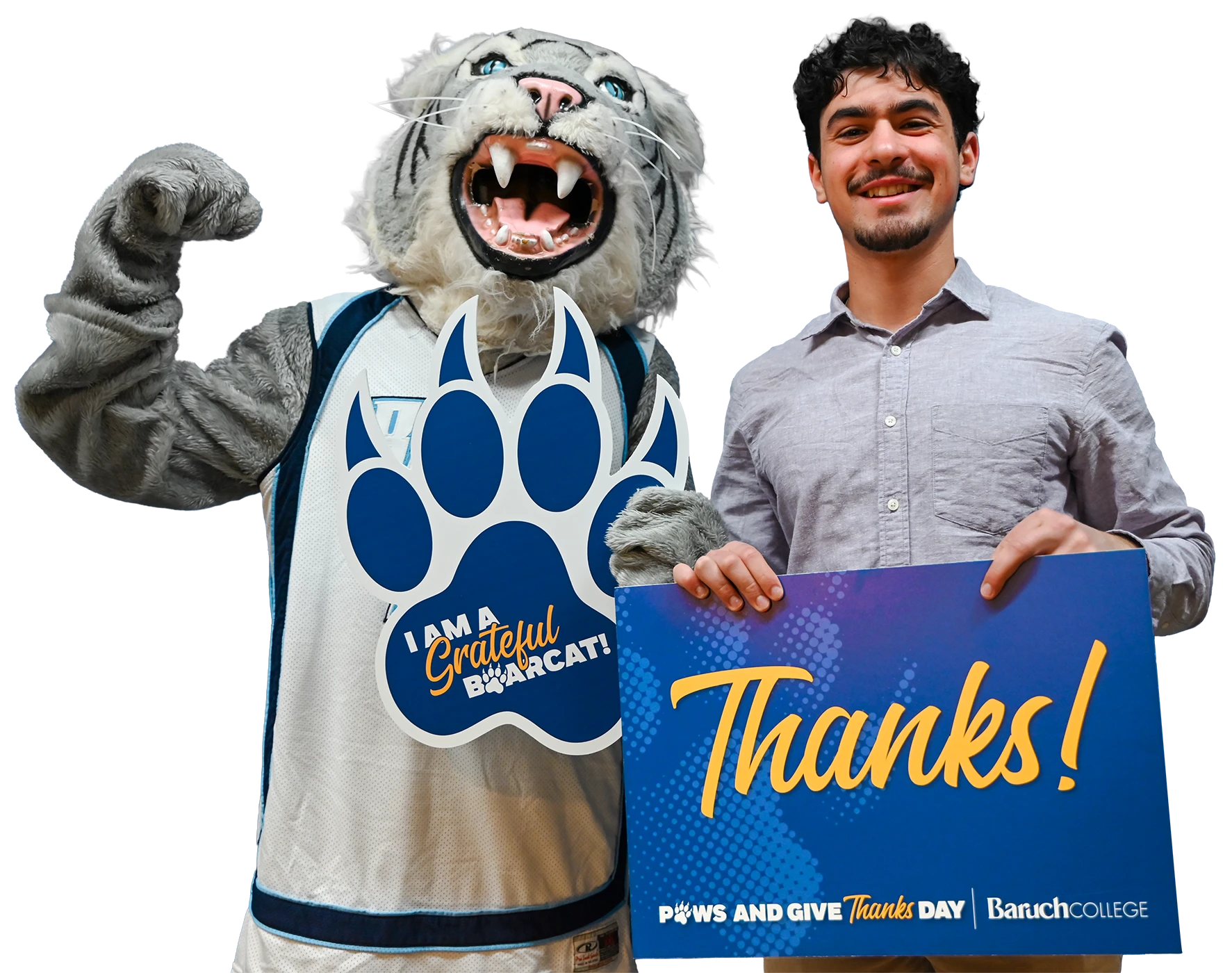 Baruch student and mascot holding up a sign with a note of gratitude for Baruch donors