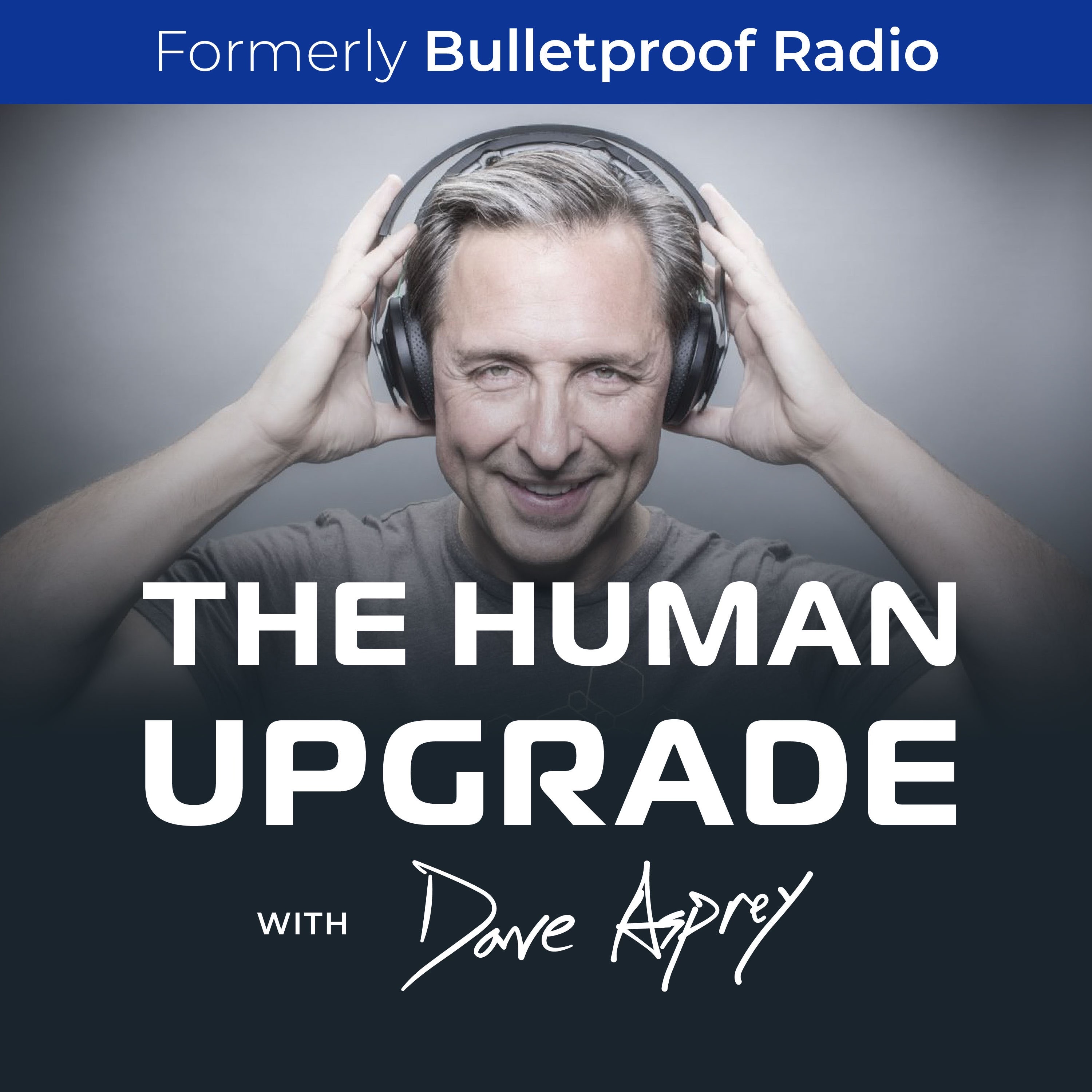 Dave Asprey wearing headphones, smiling confidently at the camera in a relaxed setting