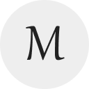 Museo logo with black M on white background.