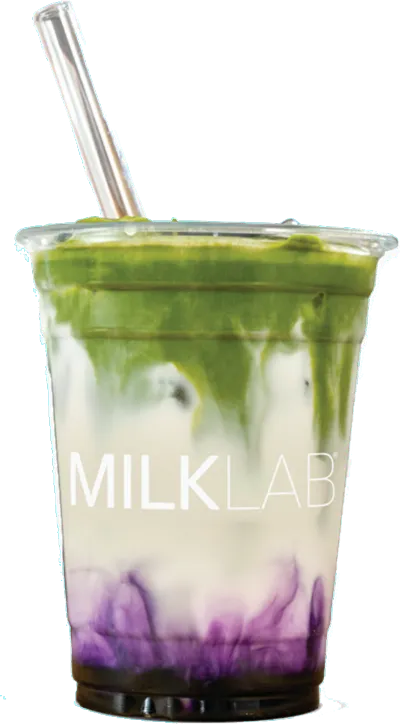 Clear cup with green matcha, white milk, and purple ube layers, topped with a clear straw, labeled MILKLAB.