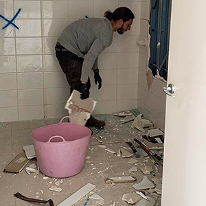 Worker from Geelong Rubbish Removal Service strips out a bathroom