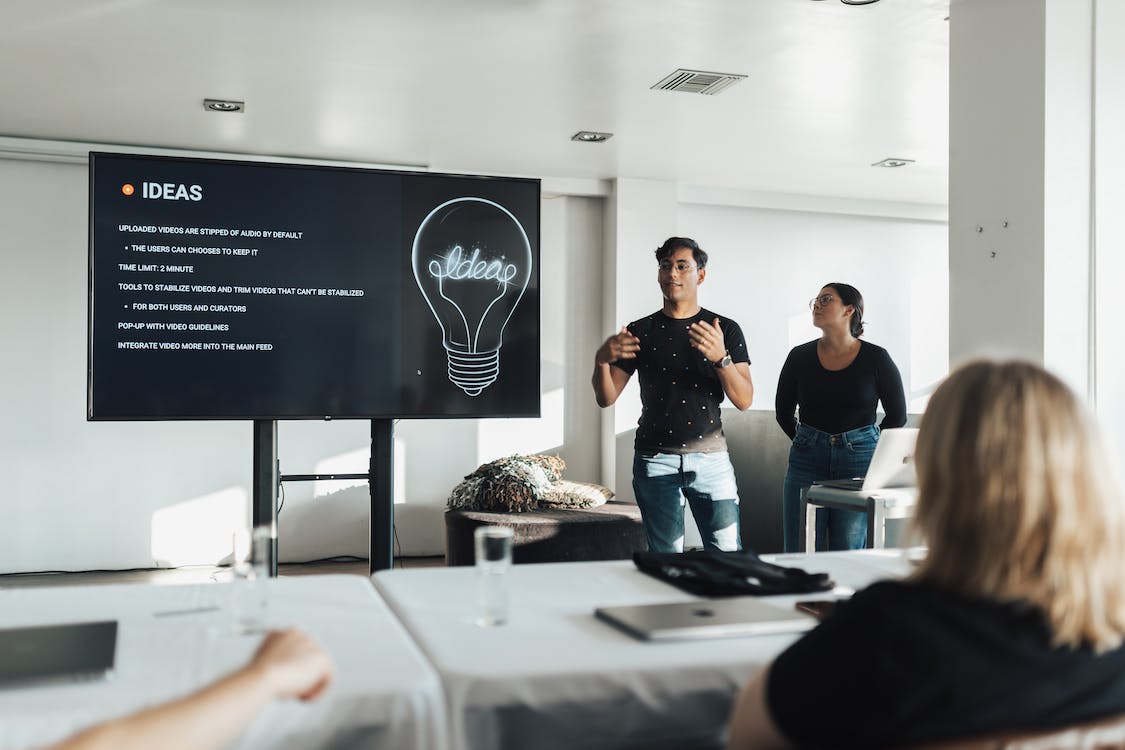 Free Man Speaking about Ideas in Meeting Stock Photo