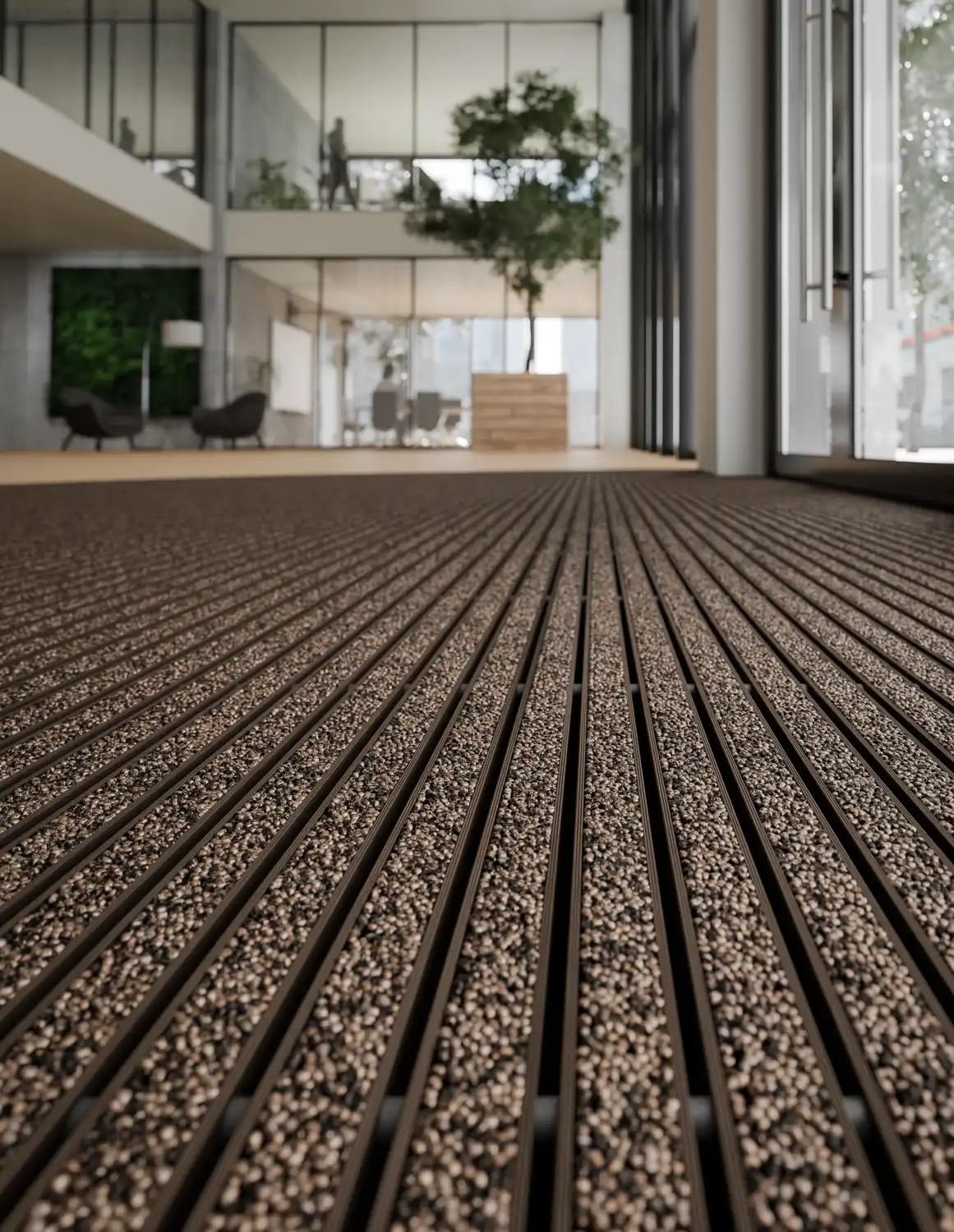 Indoor Milieu Detailshot einer großen, bronzefarbenen Aluprofil Fußmatte und der Einlage Care Beige