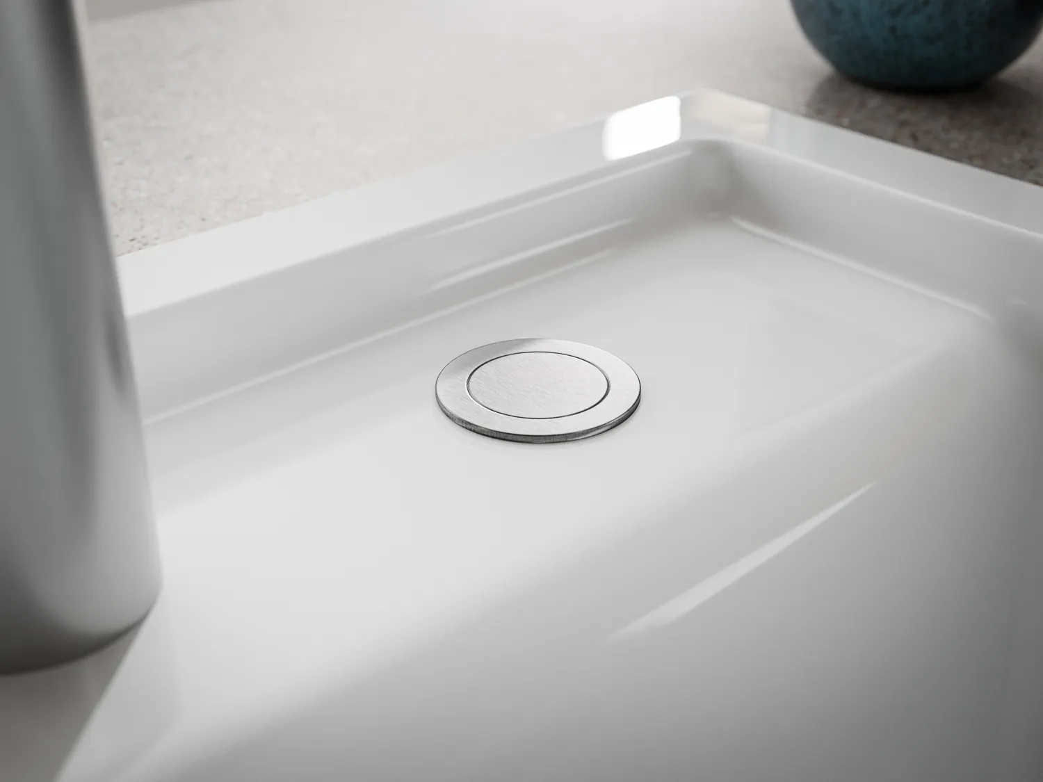 Naber Silqua Keramikspüle in Weiß in einer Küche, Detailaufnahme vom Exzenter Knopf