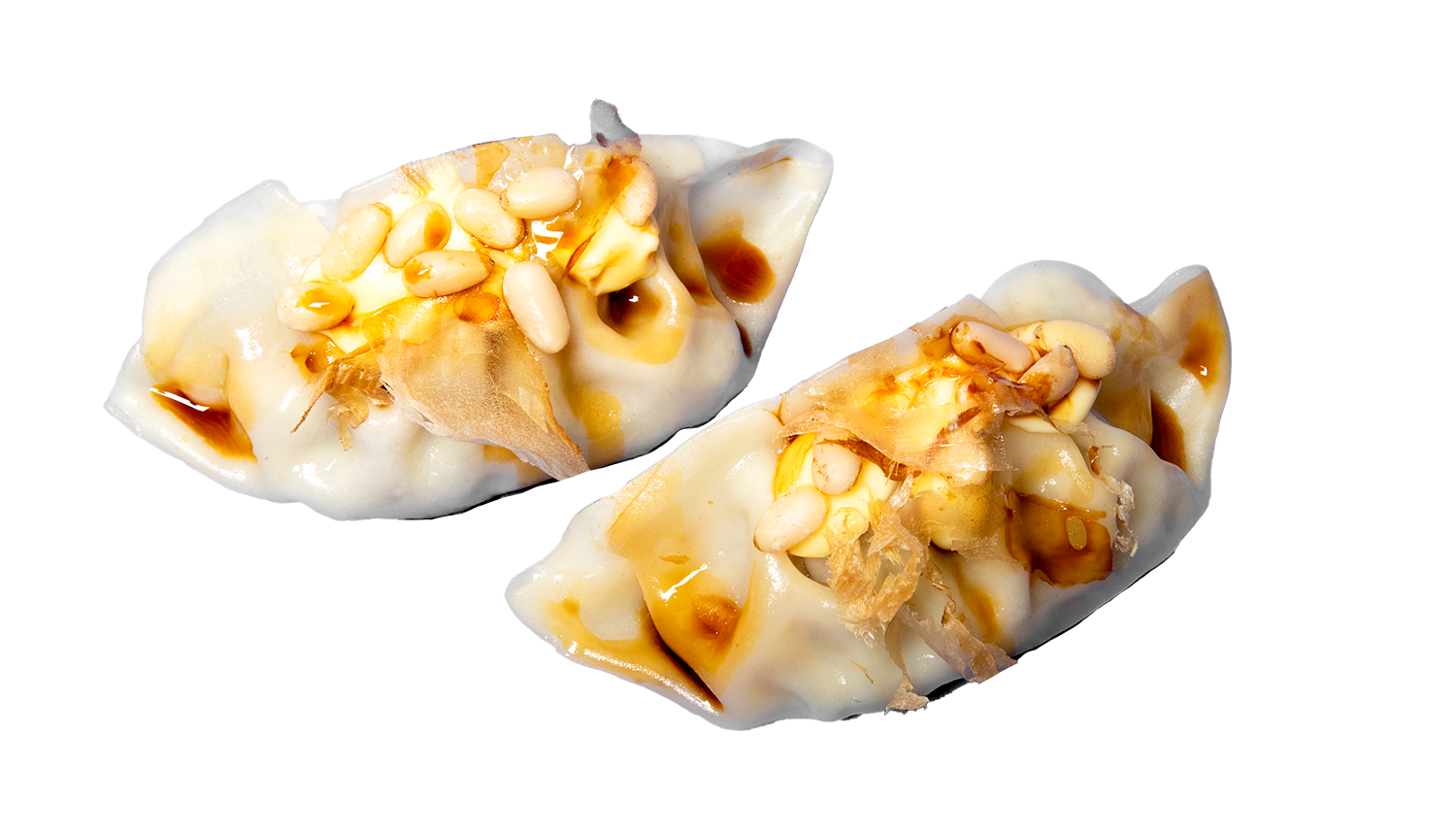 Ravioli al vapore ripieni di manzo, verdure e spezie con pinoli tostati e katsuobushi