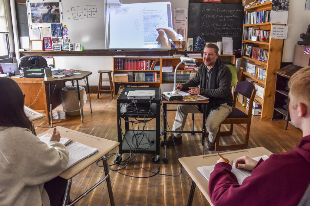 Teacher using an ELMO document camera with students
