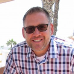 a headshot of Brett Helmen