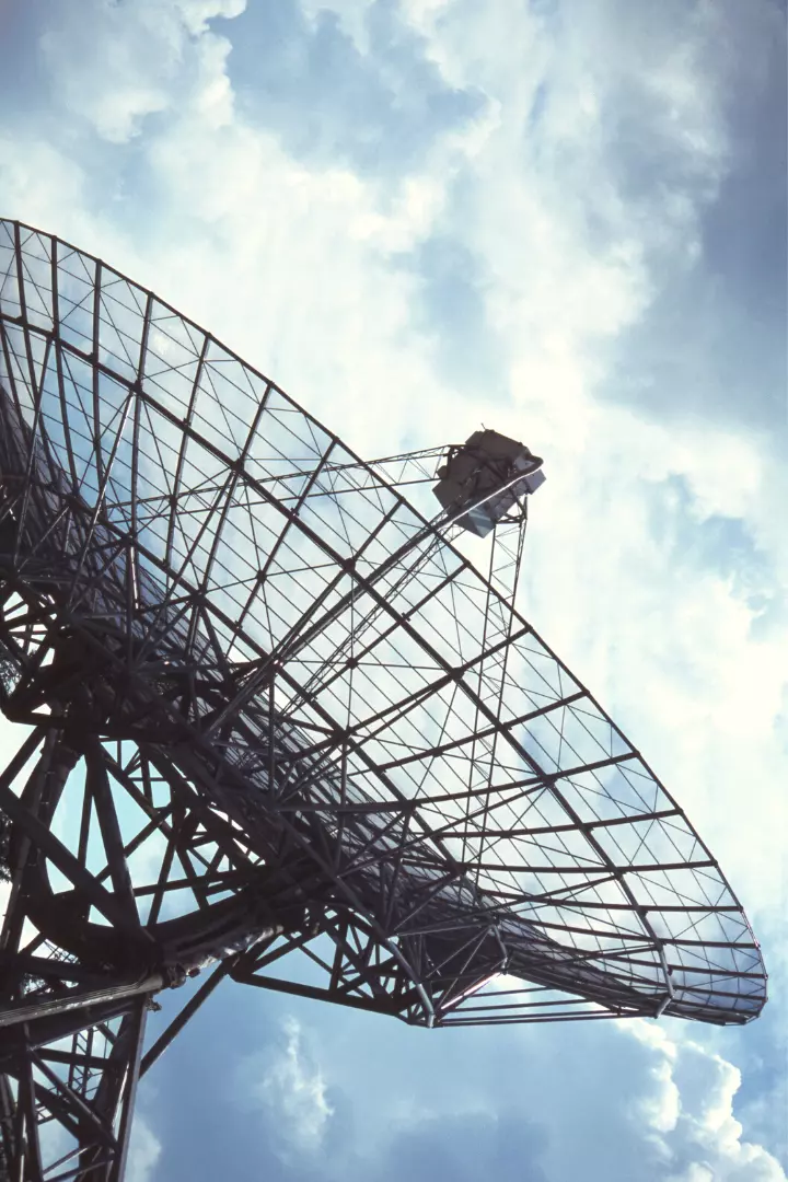 satellite dish with clouds and sky in the background