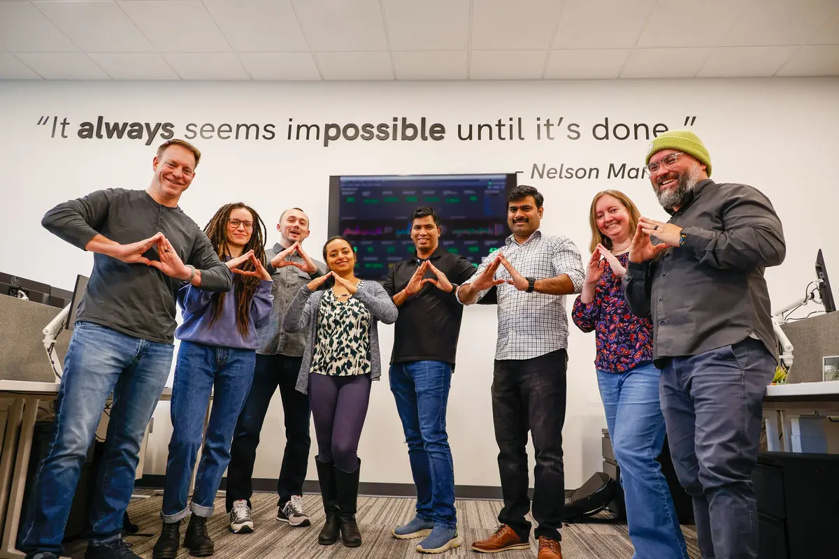 Archway employees under quote from Nelson Mandela: "It always seems impossible until it's done." Always and Possible are in bold letters.
