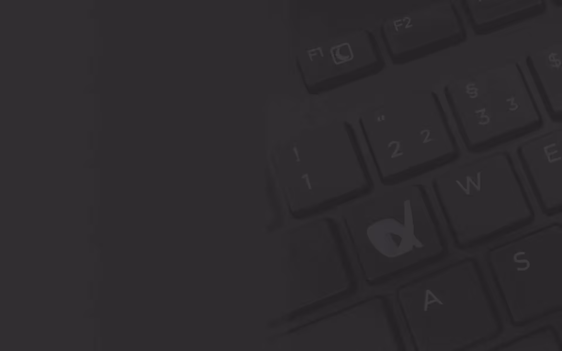 Eine Nahaufnahme einer Tastatur mit schwarzem Hintergrund