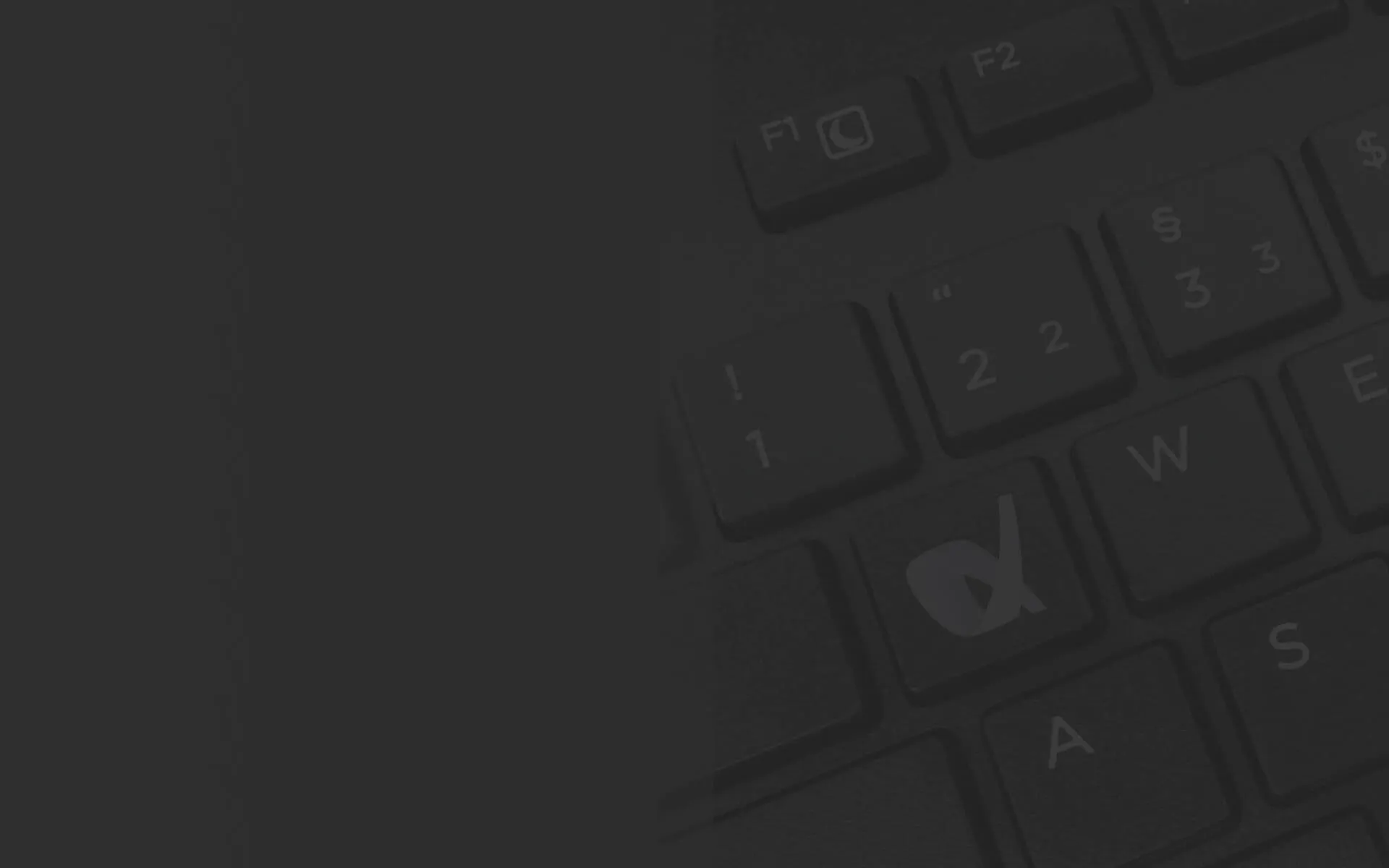 Eine Nahaufnahme einer Tastatur mit schwarzem Hintergrund