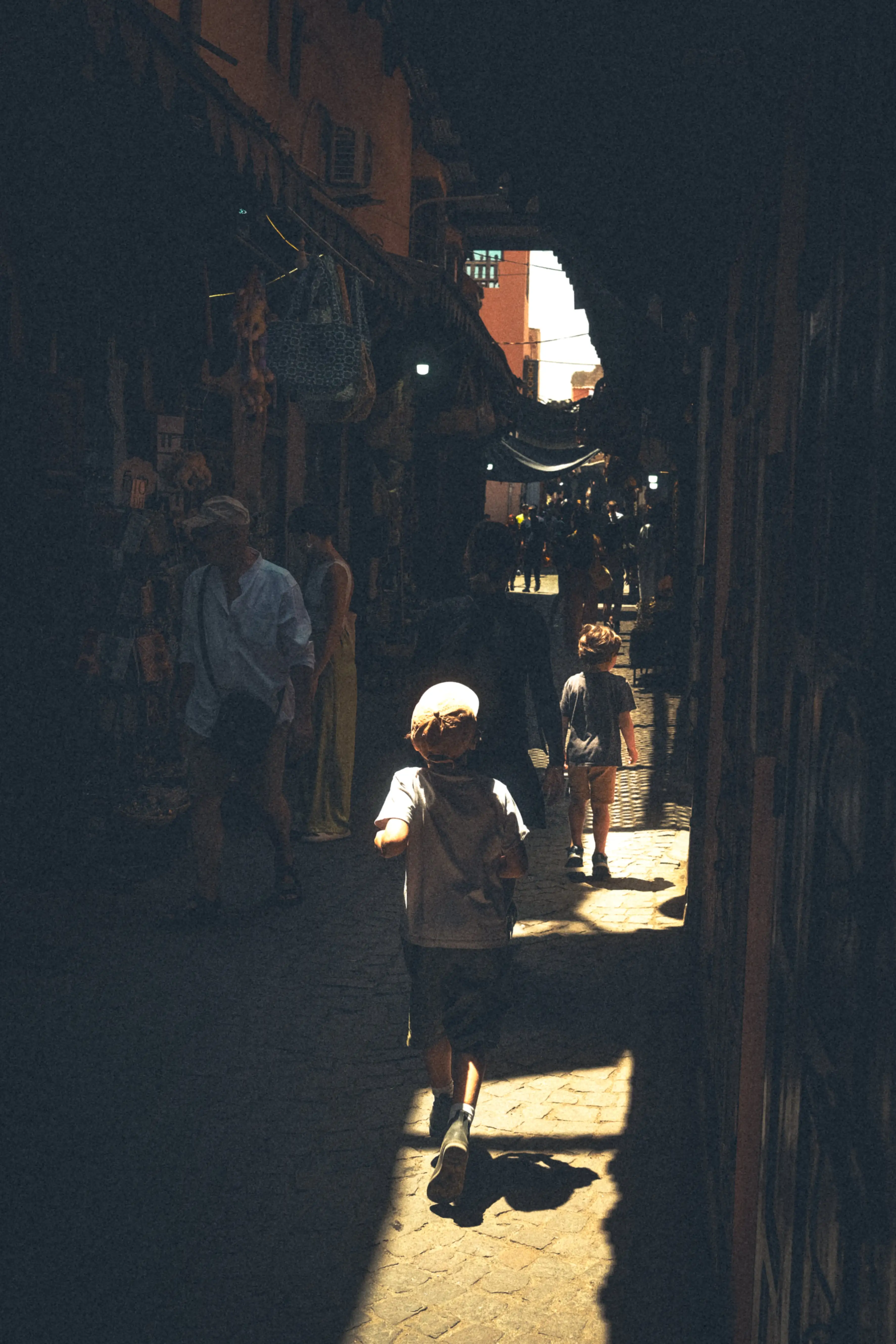 A Boy runnign down a dark alley