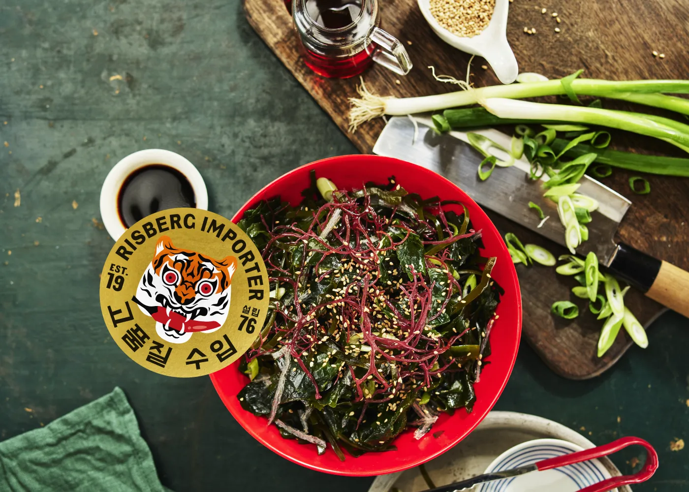 Asian dishes on a table with the Risberg Importer logo visible in the background.