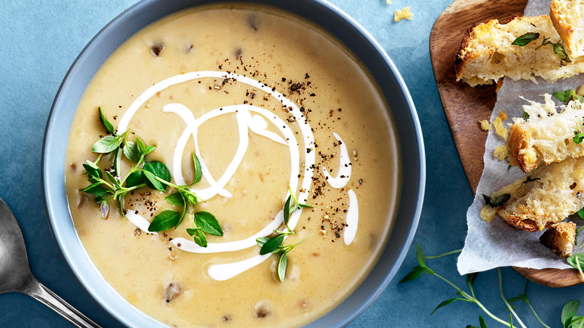 Creamy soup with herbs and sour cream served with crusty bread, fresh thyme and black pepper.