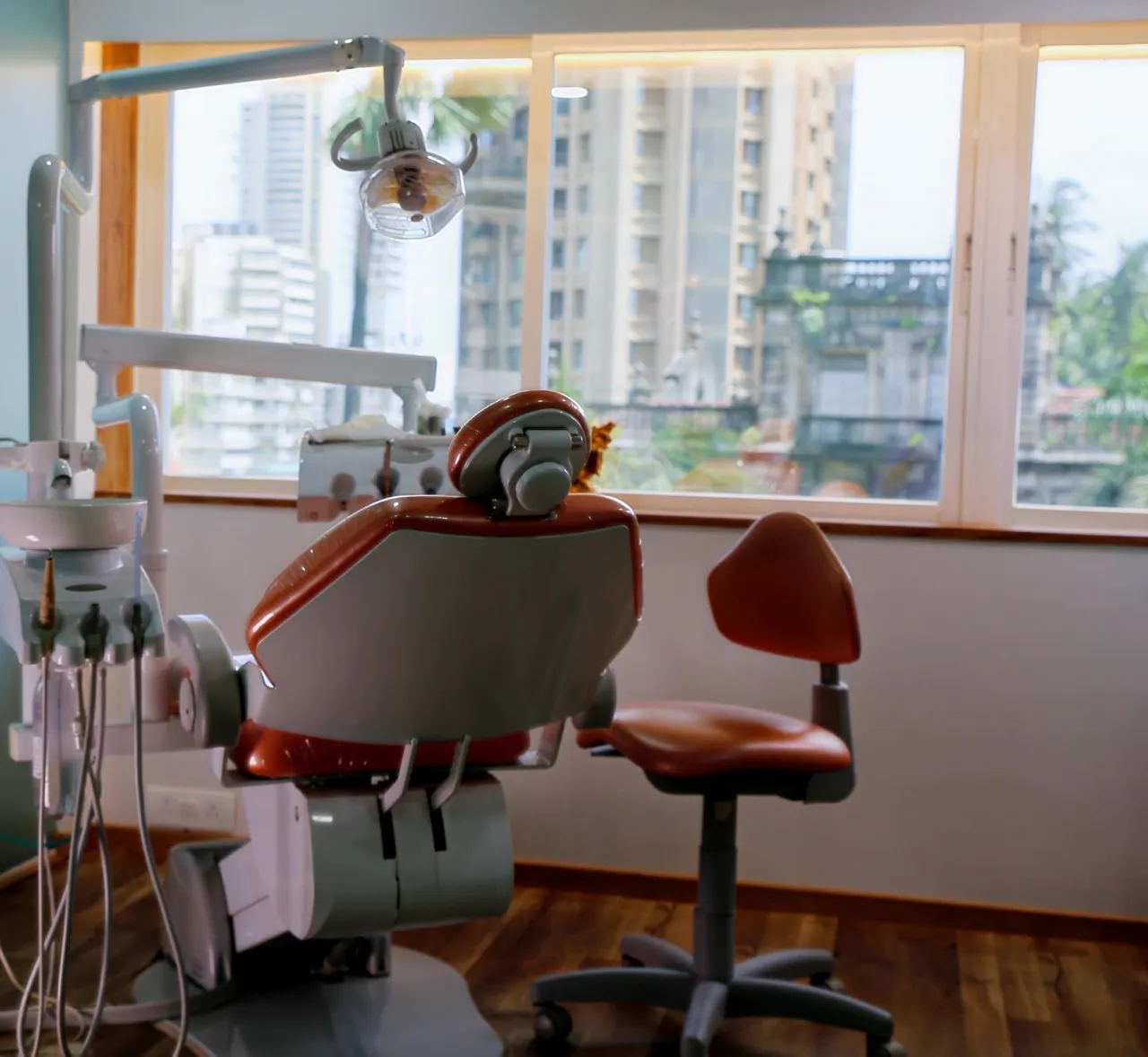 Kemps Corner treatment room with an orange dental chair beside the window