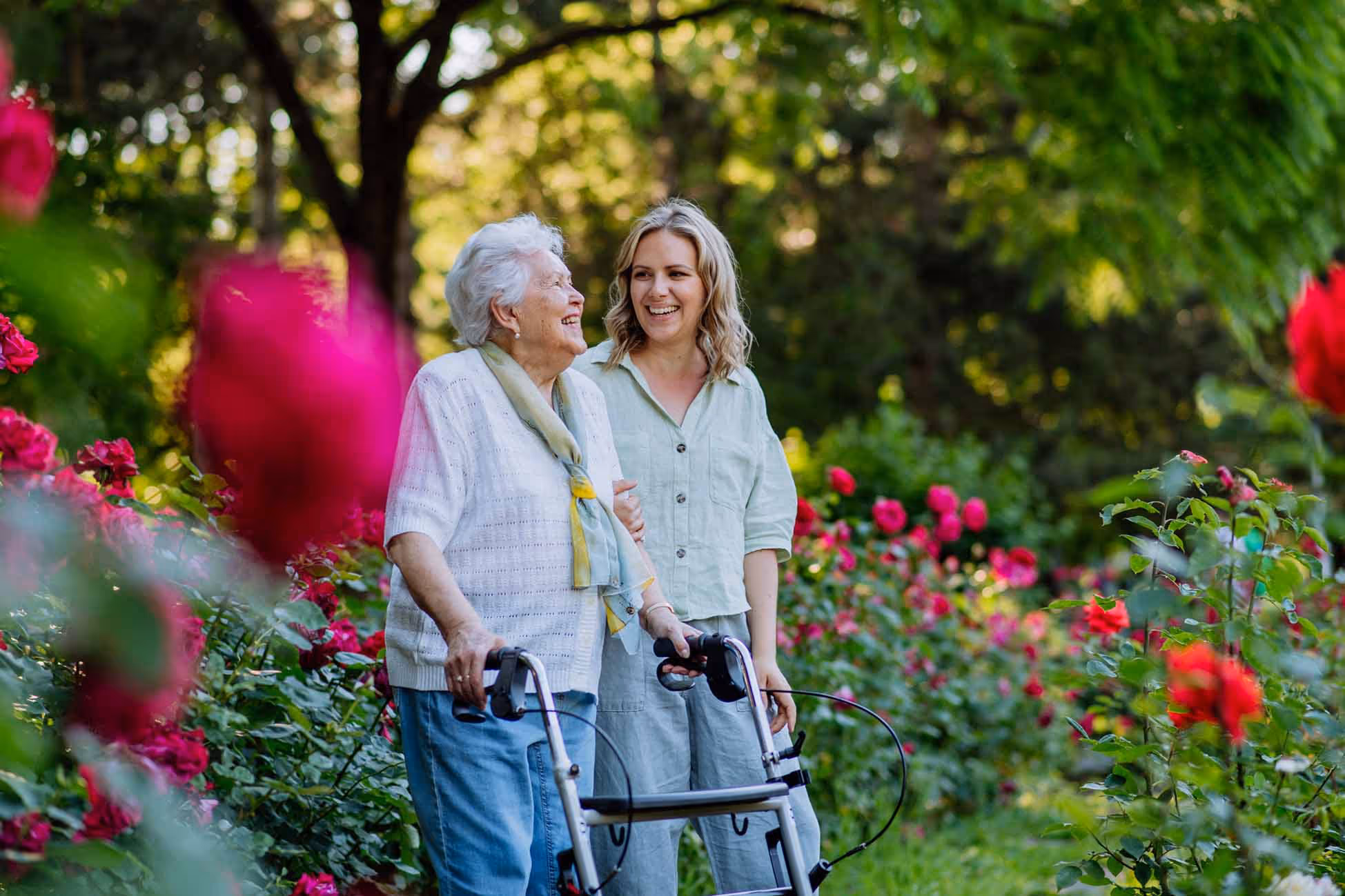 Caregiver walking with her patient.