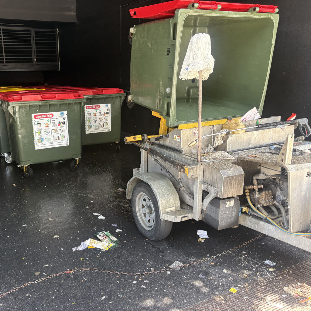 Example of Gold Coast Traditional Trailer System displaying overspray and muck spilled all over the machine and the ground
