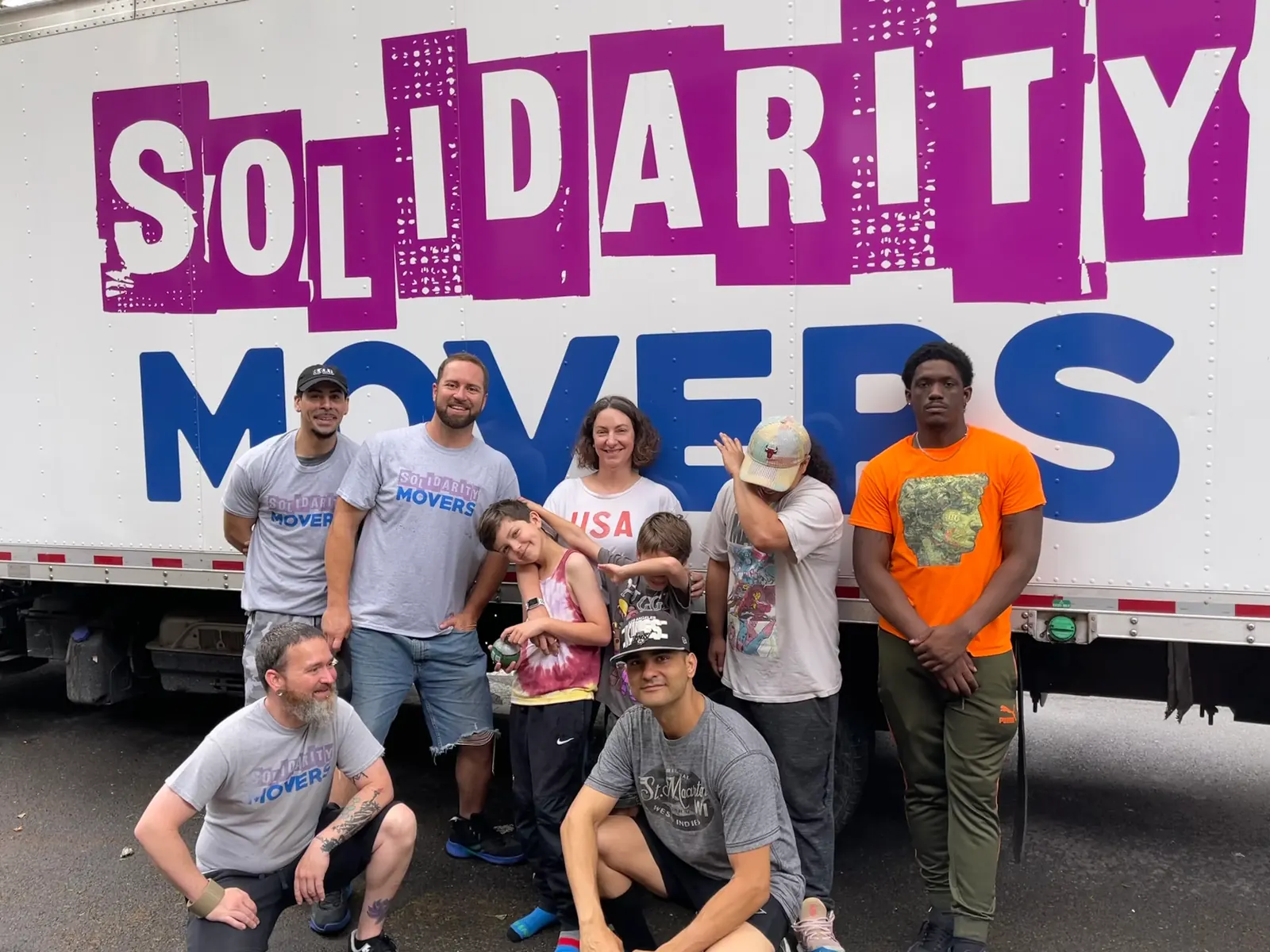 Professional NYC movers wrapping and protecting furniture for transport
