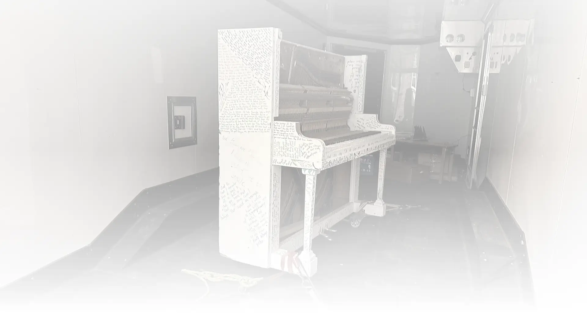 Movers handling a piano