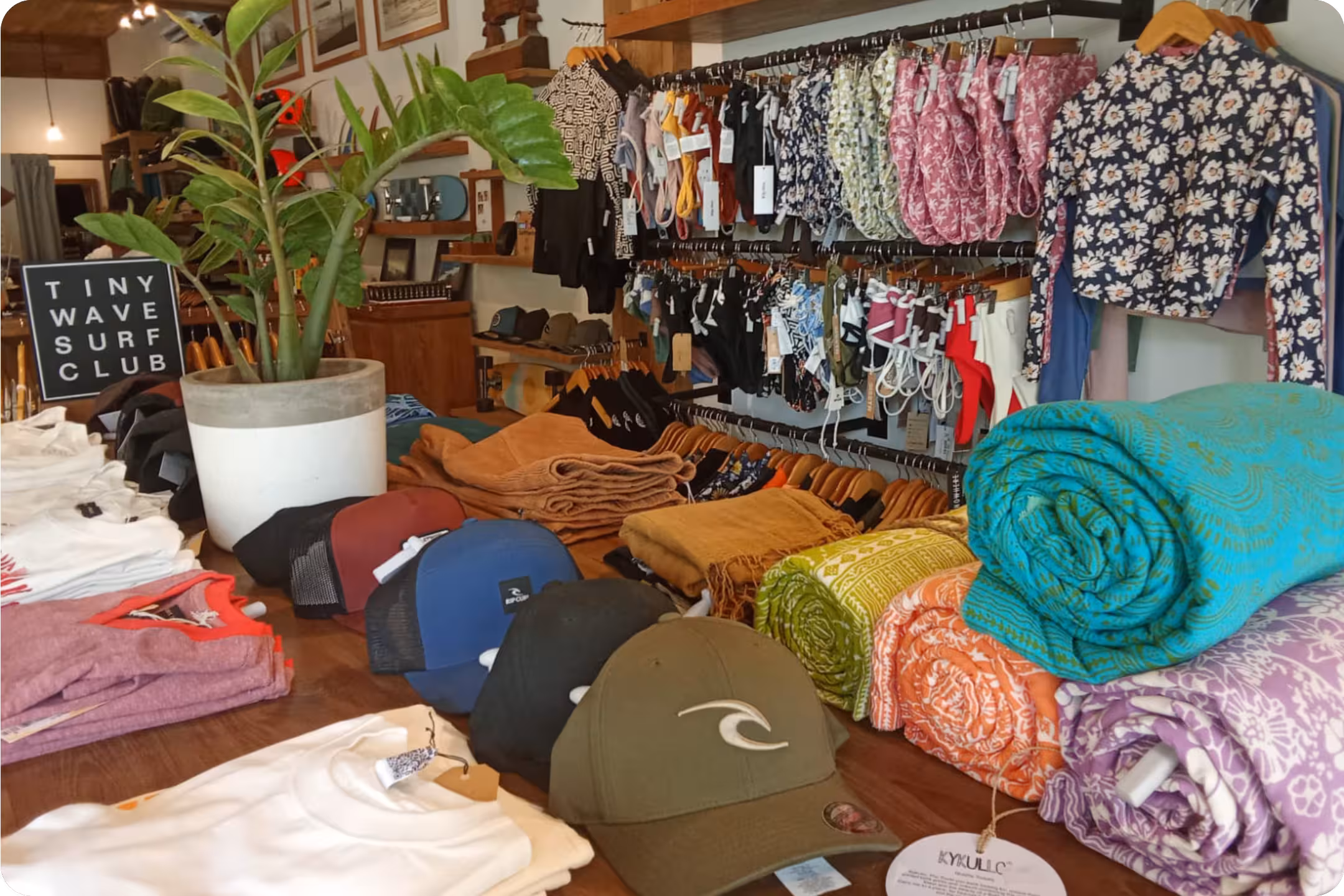 A table of accessory brands at Flow Surf Lombok