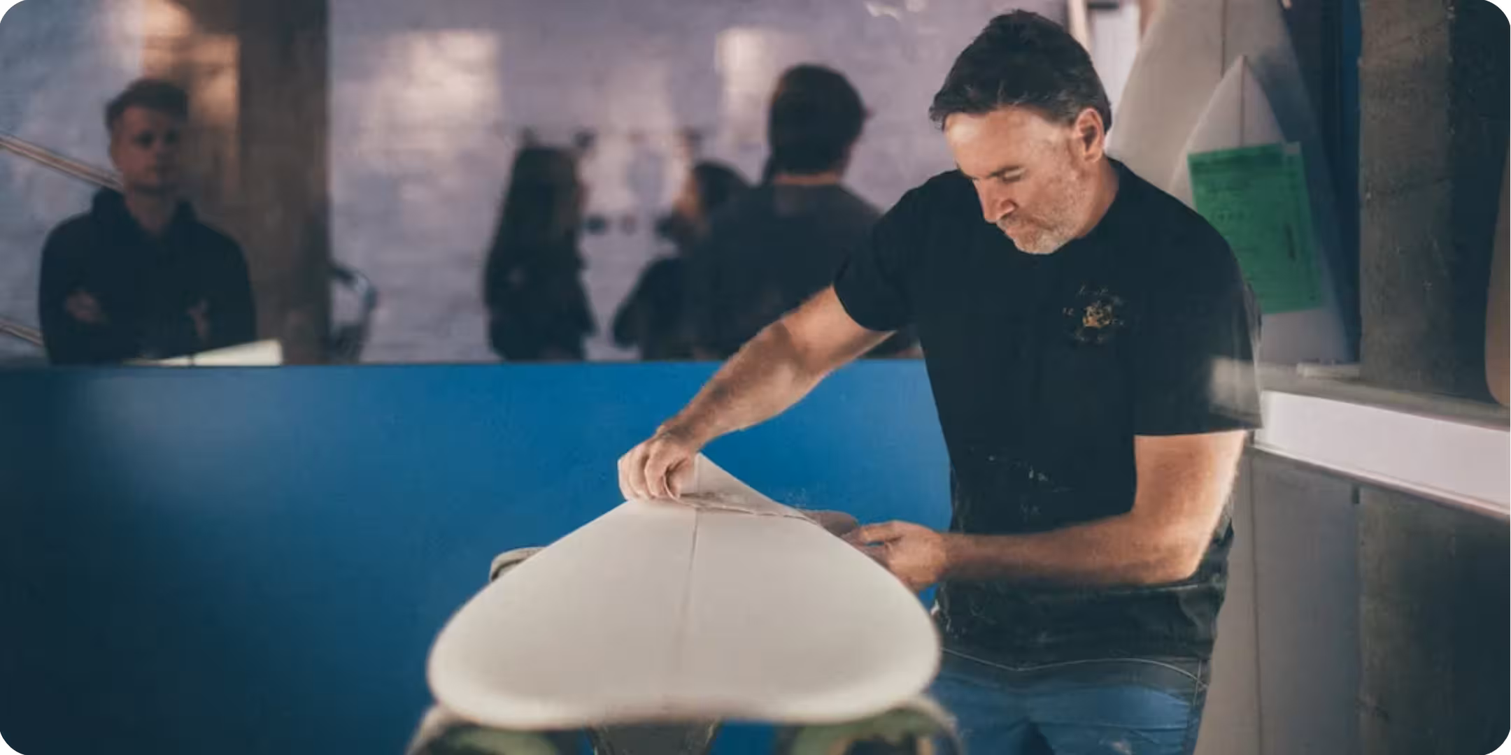 Matt Biolos shaping a surfboard