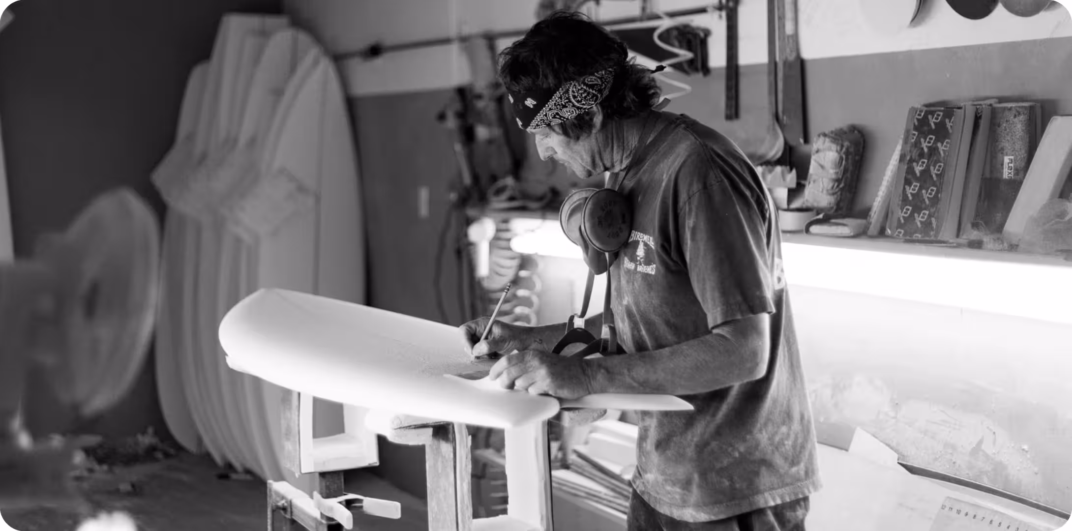 Chris Christenson shaping a surfboard