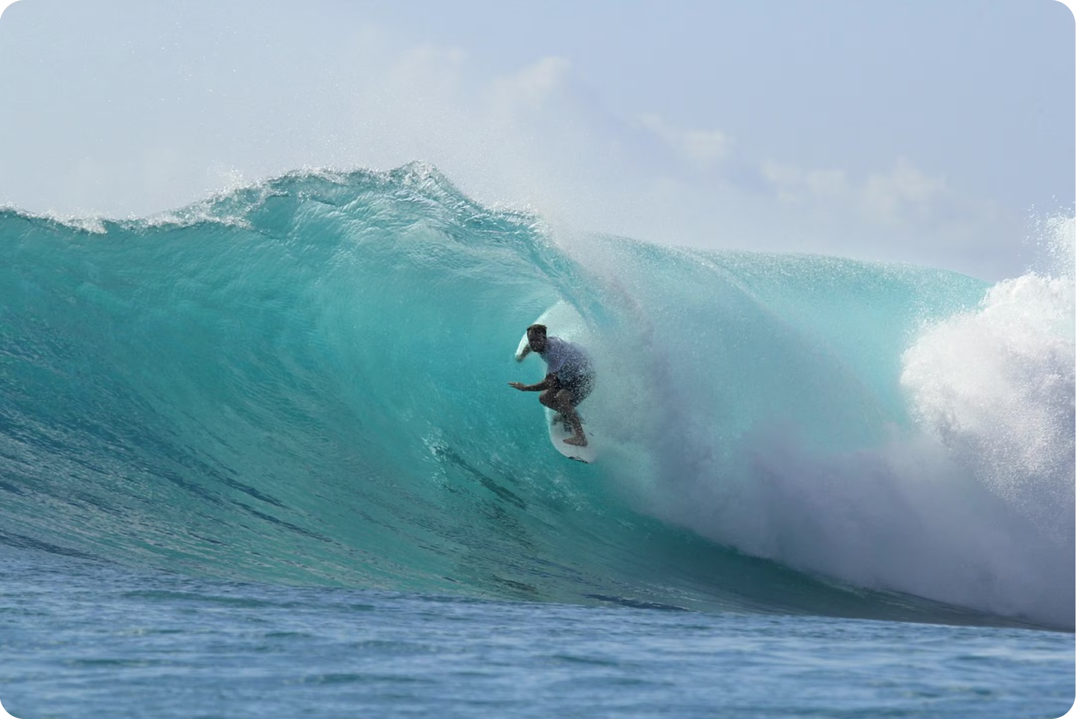 A man riding in a tube on a wave in the Gili Islands in Indonesia