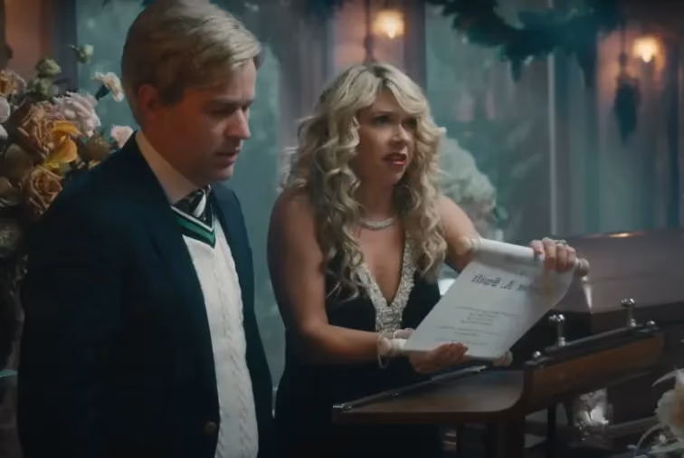 man and woman reading a will in taylor swifts music video