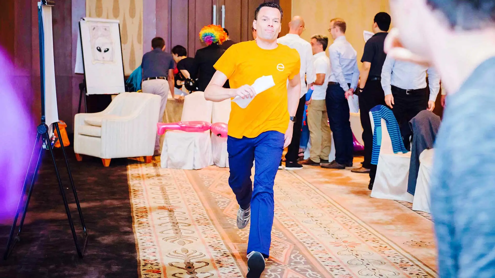 Presenter walking through the room at a Covestro innovation event