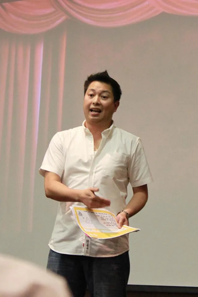Sandbox Global participant presenting an idea in front of a screen