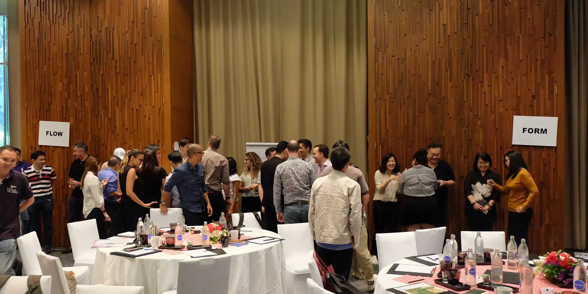 Brand Connect team grouping by style between Flow and Form signs at their event