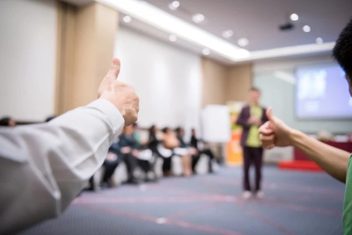 Delegates giving a thumbs up during the TIPS workshop