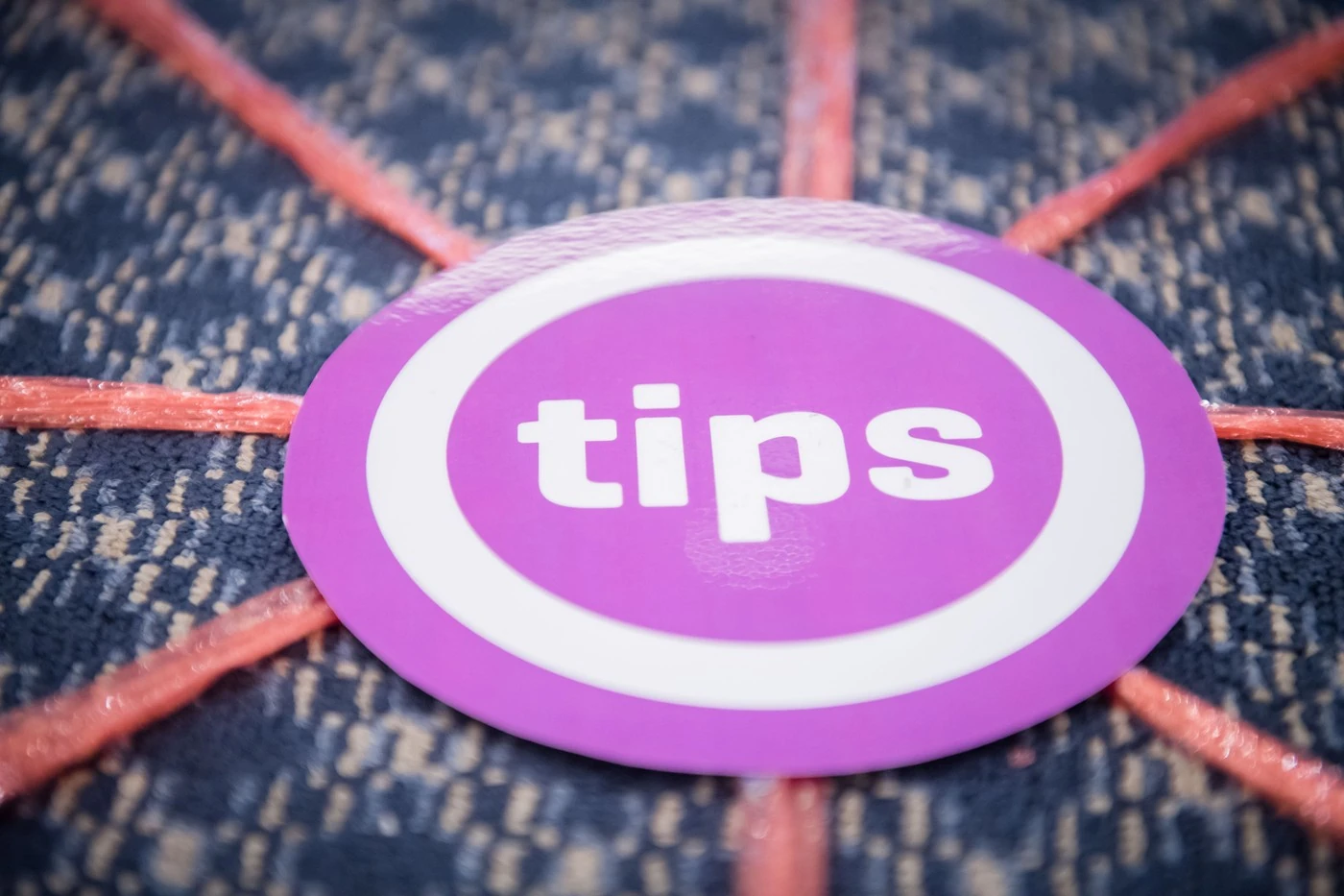 Round TIPS marker at the centre of the floor map in the workshop room