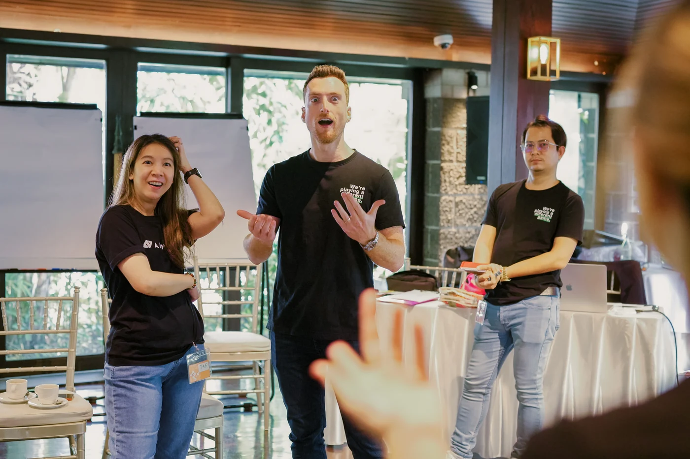 Ampverse team members reacting during a TIPS game