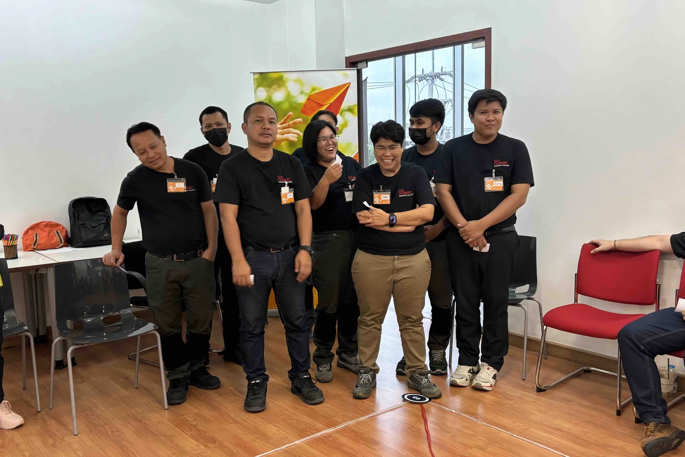 Group of Ruwac Asia team members standing together on one spot of the TIPS Profiling Map on the floor