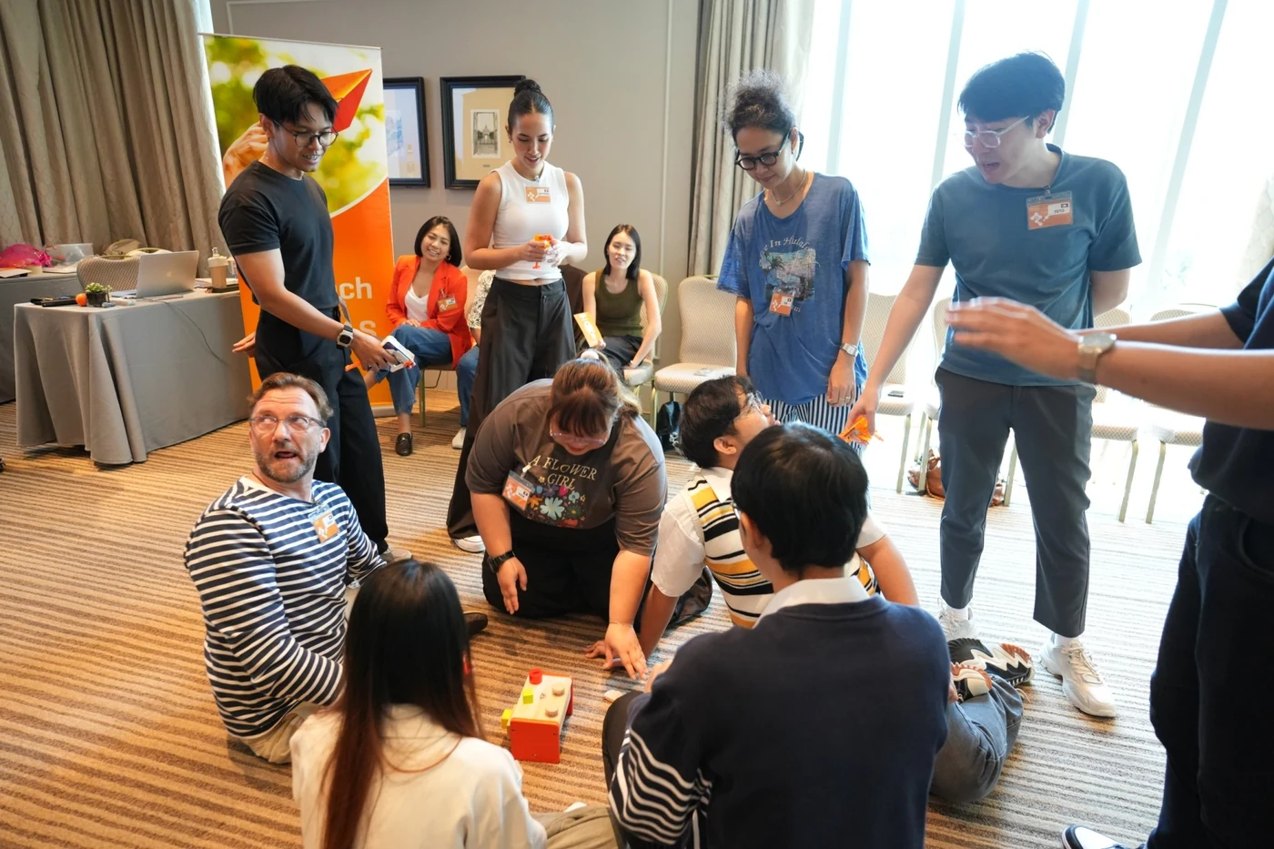 Square 44 team members playing a TIPS game on the floor