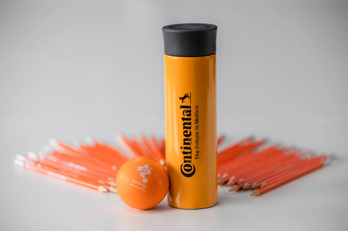 Continental bottle, pens and ball on the workshop table
