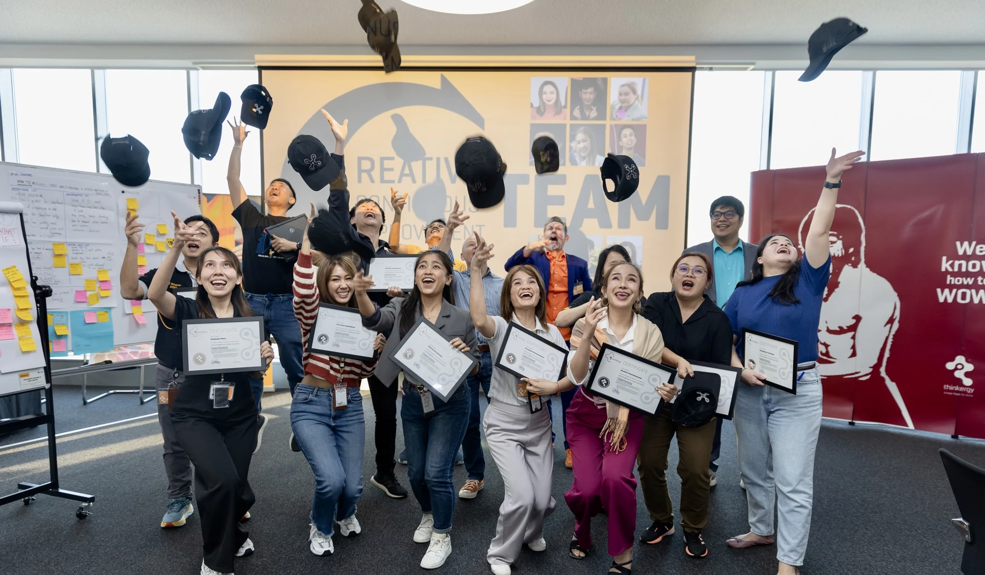 Continental Tyres Thailand’s newly certified in-house X-IDEA facilitators throwing their caps in the air