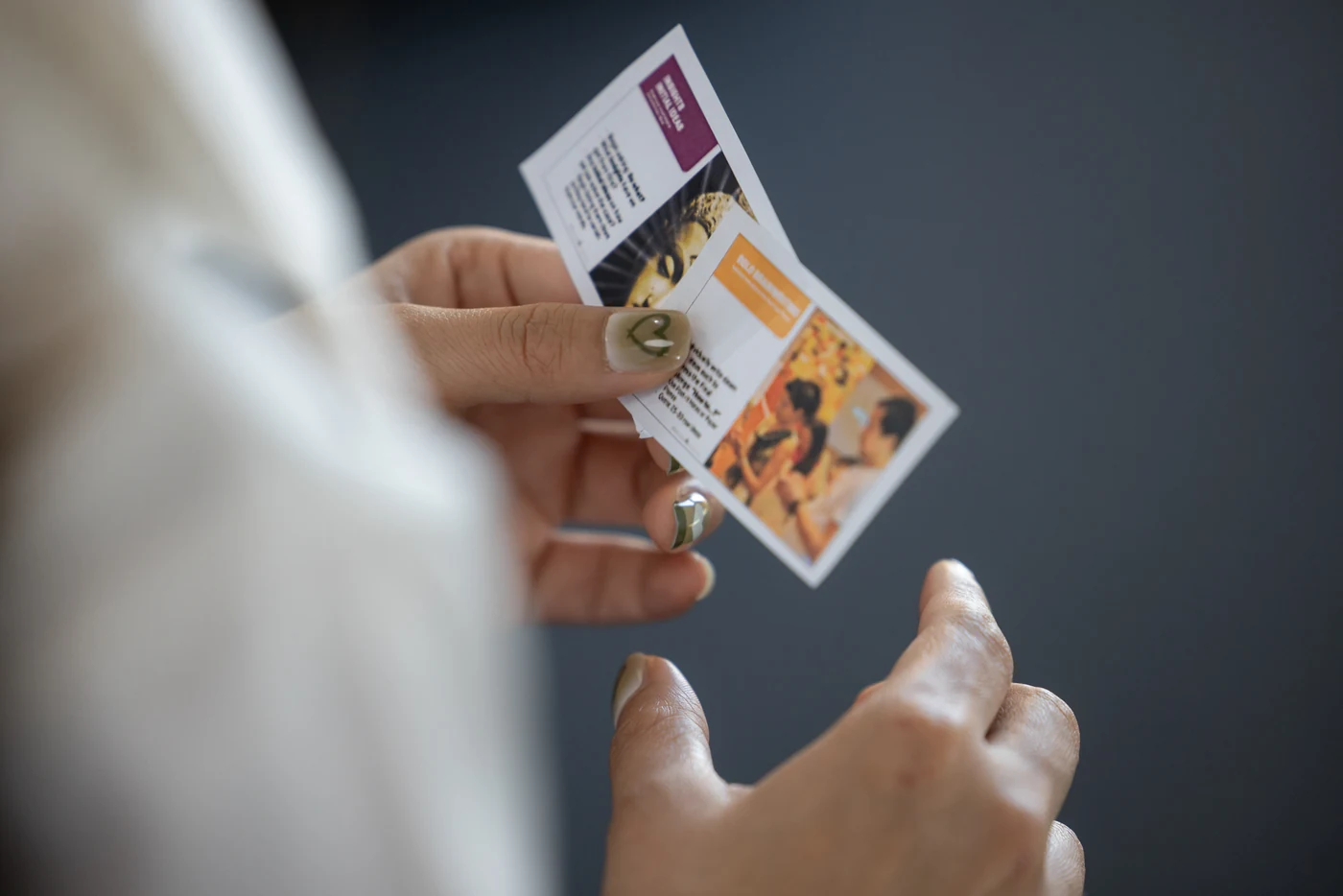 A participant holding an X-IDEA stimulus card