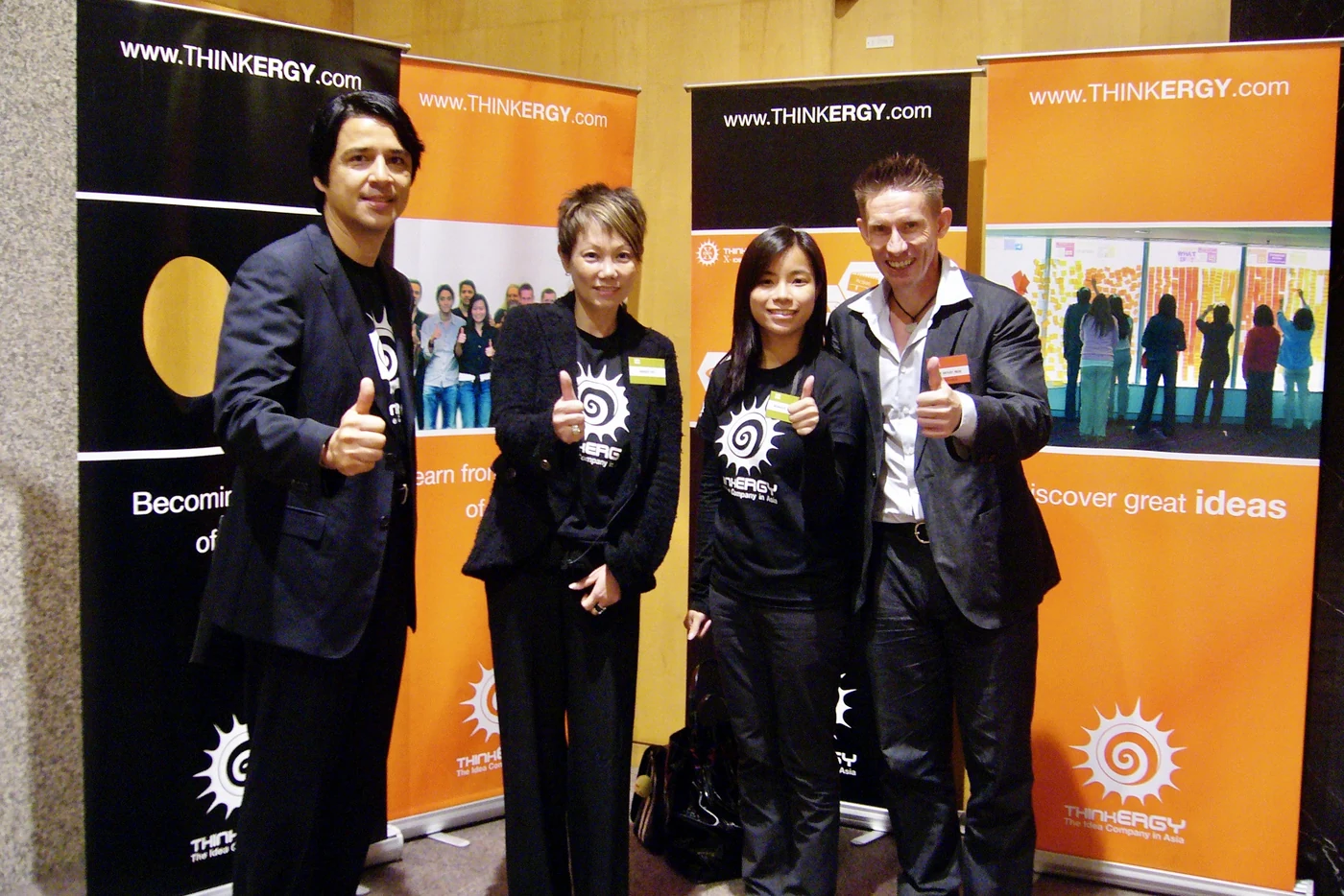 The Thinkergy team in front of its banners at the conference