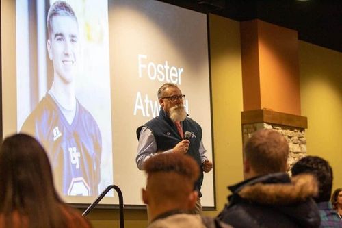 Kevin giving a presentation to a crowd.