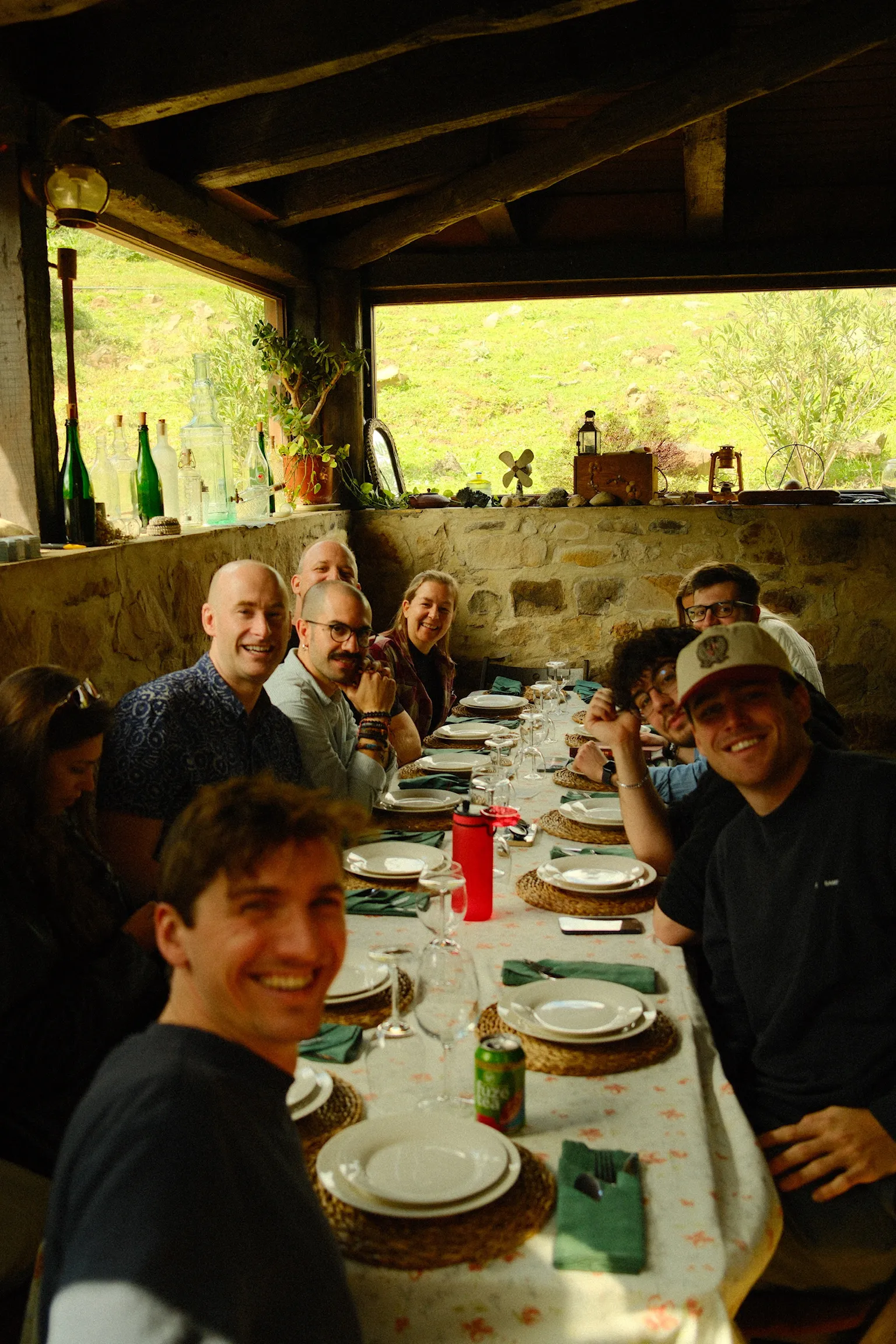 Shared dinner at a long table in a Casa Basilico coliving community