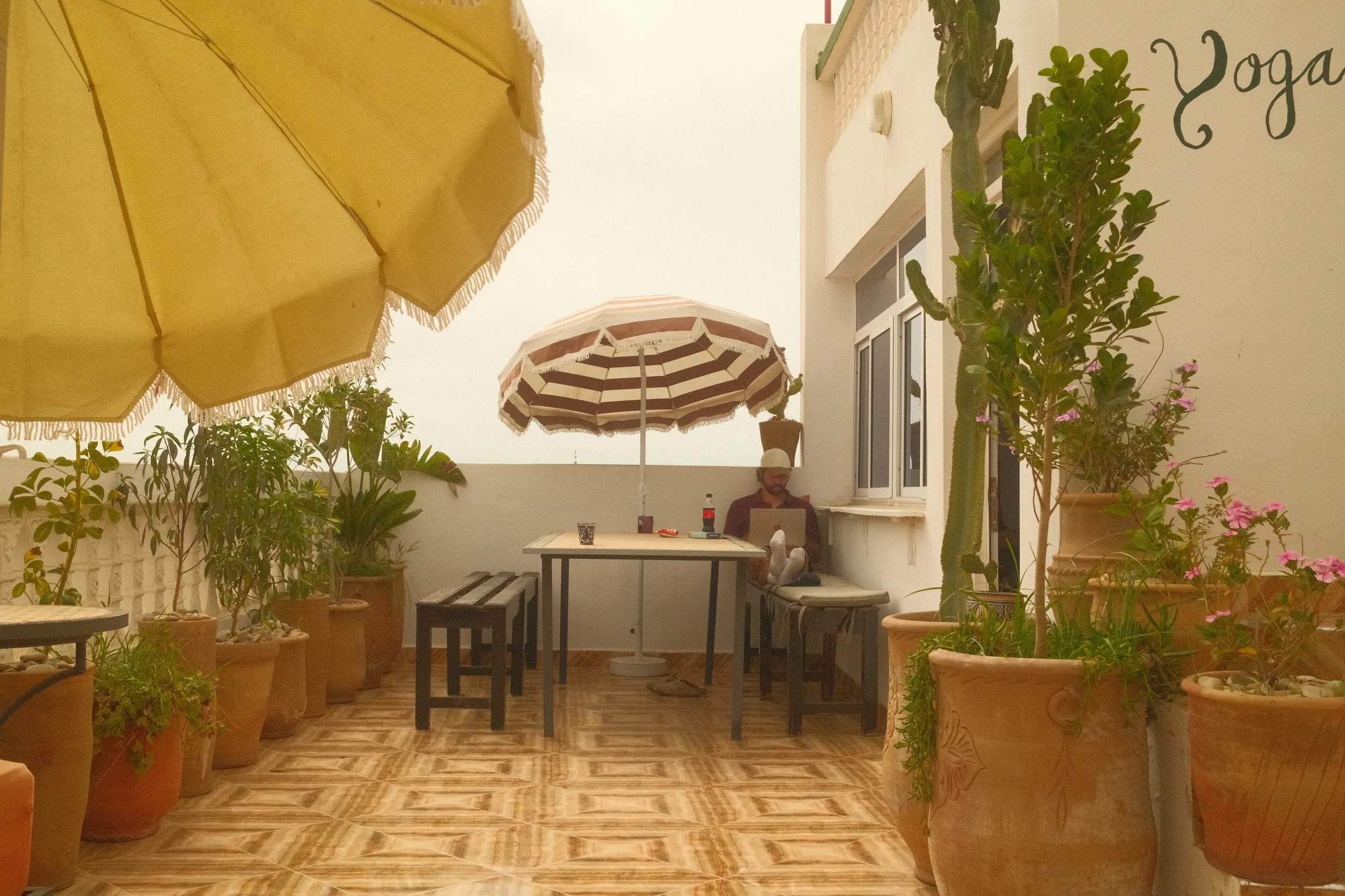Group coworking session inside Casa Basilico’s open-air workspace Marocco