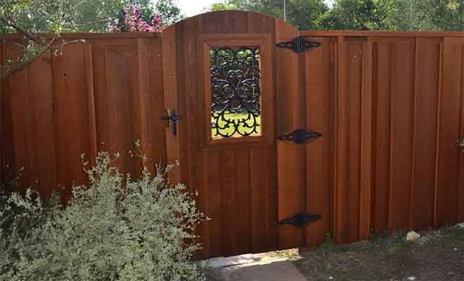 Cedar gate with decorative wrought iron inserts