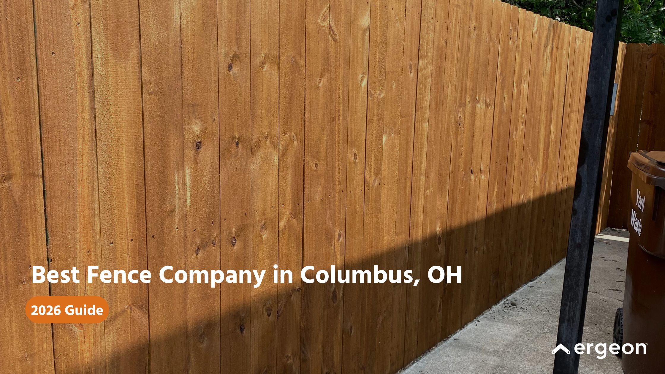 Best Fence Company in Columbus, OH - 2026 Guide This image features a newly installed wooden fence with vertical planks, set alongside a concrete pathway. It is used as a promotional visual for a guide on the best fence companies in Columbus, Ohio, for the year 2026. The image is professional and suitable for use in home improvement, construction, or landscaping knowledge bases to illustrate quality fencing work and local service recommendations.