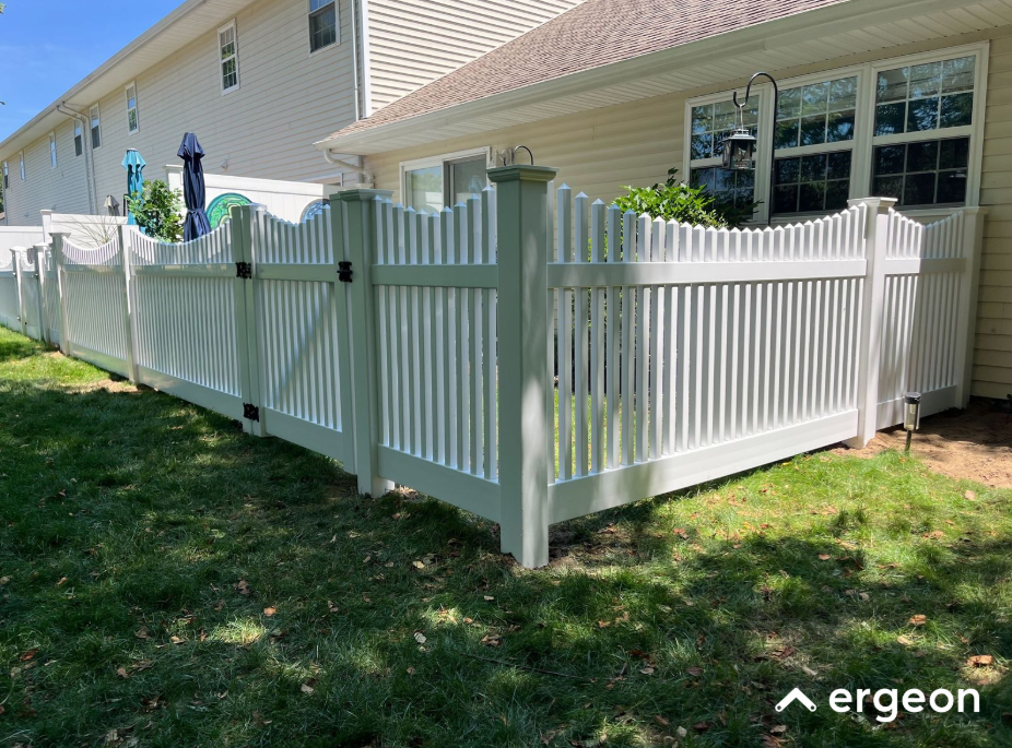 White Picket Fence Installed Around Residential Backyard