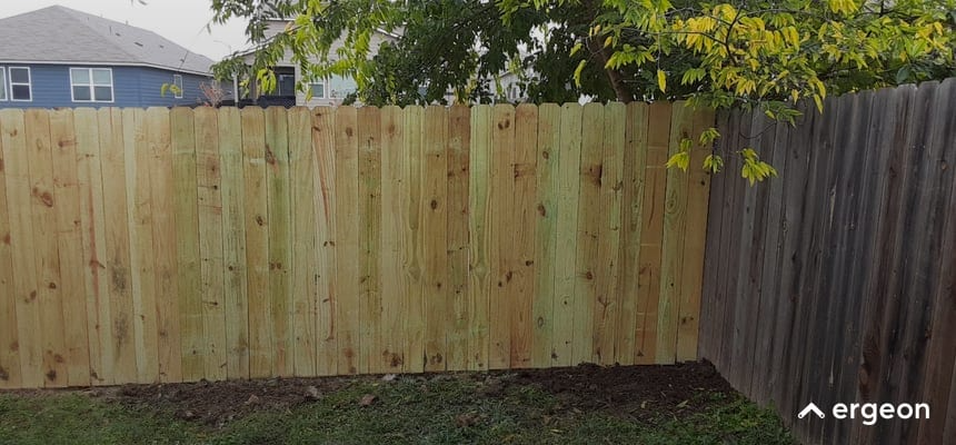 New Wooden Privacy Fence Panel Installed Adjacent to Older Fence