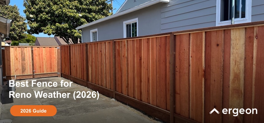 This image shows a newly installed wooden fence along the perimeter of a residential property, designed to withstand the weather conditions typical of Reno. The fence is composed of vertical cedar panels with a reinforced top and bottom rail for enhanced durability. The setting indicates a suburban area with a concrete pathway adjacent to the fence. This type of fence is recommended for homeowners seeking long-lasting weather resistance and privacy in arid and seasonal climates similar to Reno's.