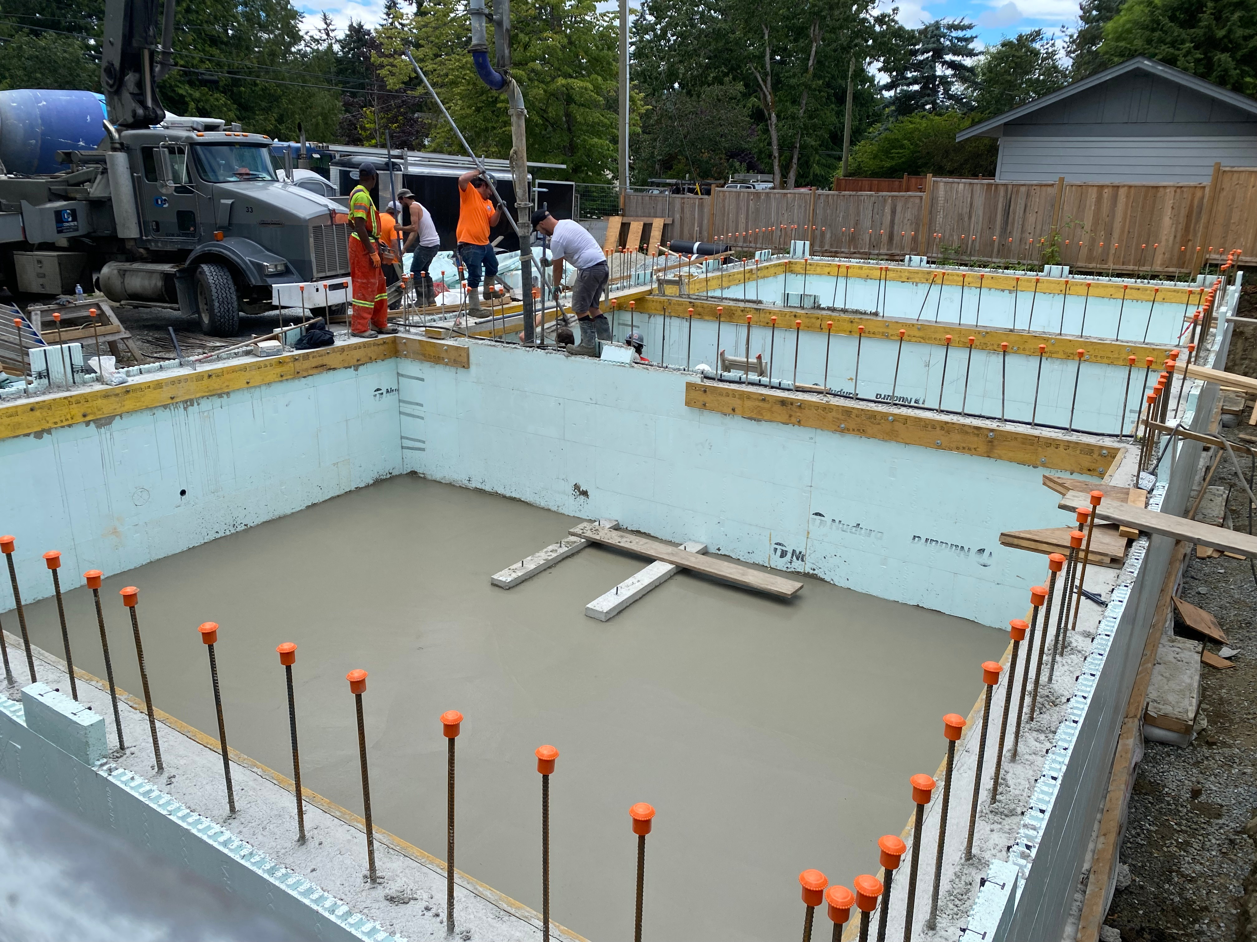 Crawlspace slabs being poured with a smooth finished
