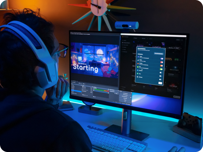 Streamer at their computer using the Streamlabs for OBS Plugin